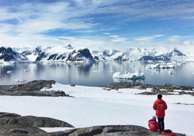 An image of a person standing on a rock, 4-Day Adventure To Antarctica. White Desert
