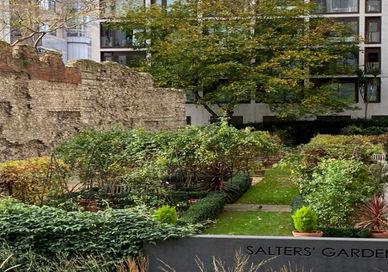 An image of a garden in the middle of a building, Private Walking Tour of Secret Gardens and Hidden Churches. Who Knew Tours