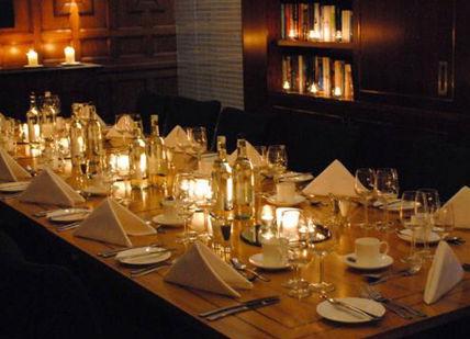 An image of a long table set for dinner, Victoria, London. Wine Cottage