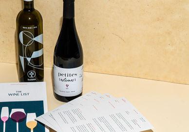 An image of a wine bottle and menus, Three-Month Virtual Wine Course. The Wine List