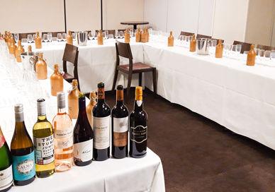 An image of a table with wine bottles and glasses, Private Wine Tasting Masterclass. Winfield Wine Tastings London