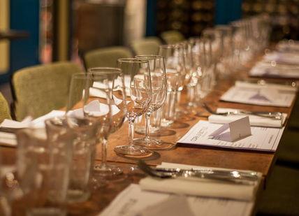 An image of a table setting with empty glasses, Cote Brasserie. Winfield Wine Tastings London