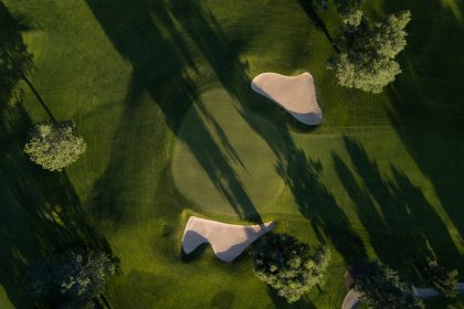 Bird's eye view of lush green golf course
