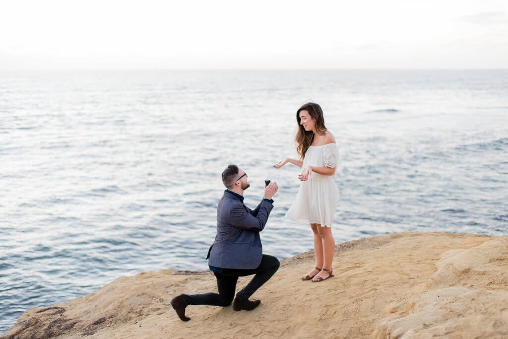 Man Proposing to Woman by the sea