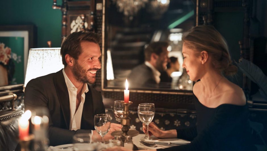 Man and woman enjoying romantic once-in-a-lifetime meal