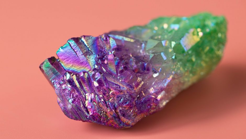 Natural quartz crystal with a bright luster. Angel Aura Quartz for healing, practice, reiki, meditation. Natural semi-precious stone close-up