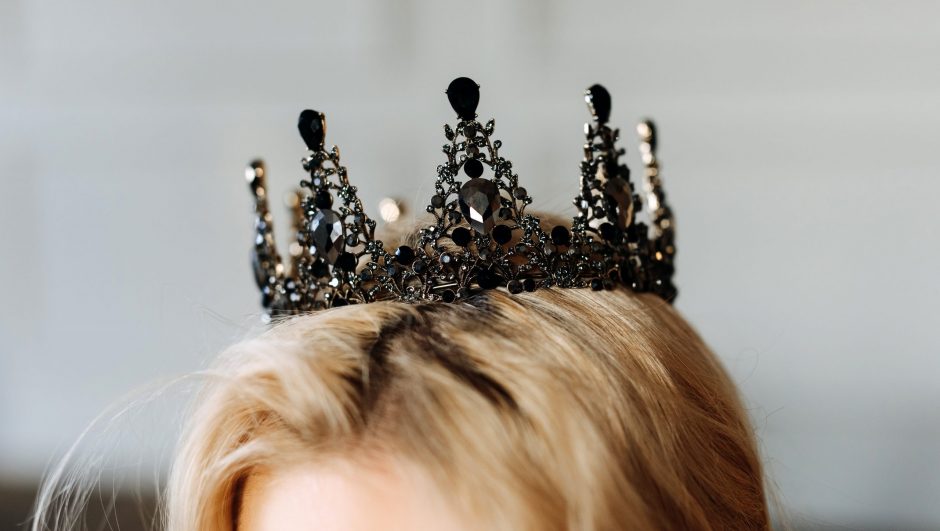 Closeup of a black diamond crown on woman's head.