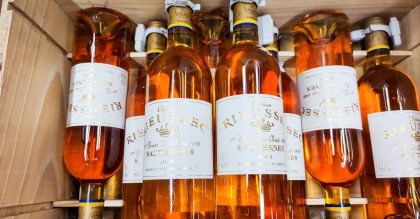 Surgeres, France - October 17, 2020:Close-up of a wooden wine box containing a great French sweet white wine classified under the Sauternes appellation