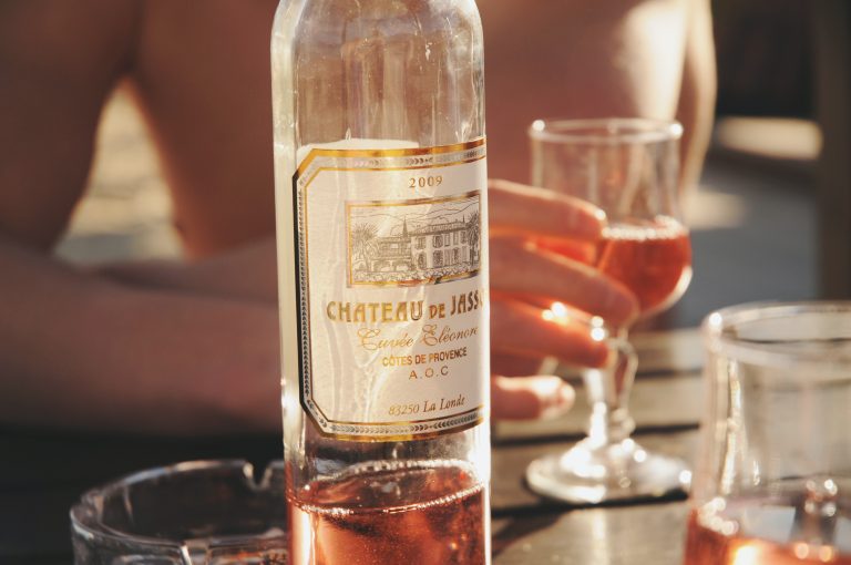 rosé wine bottle on the beach summerfeeling in france