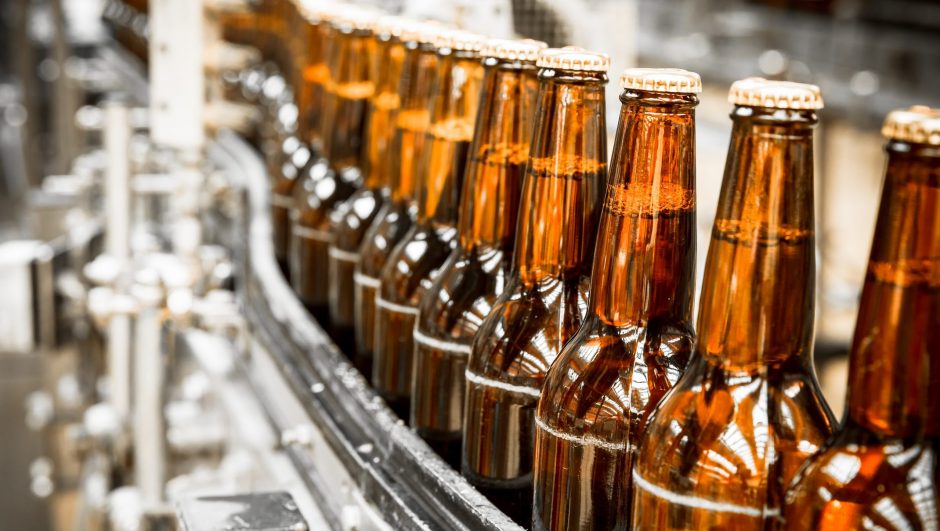 Beer bottles on the conveyor belt, brewery