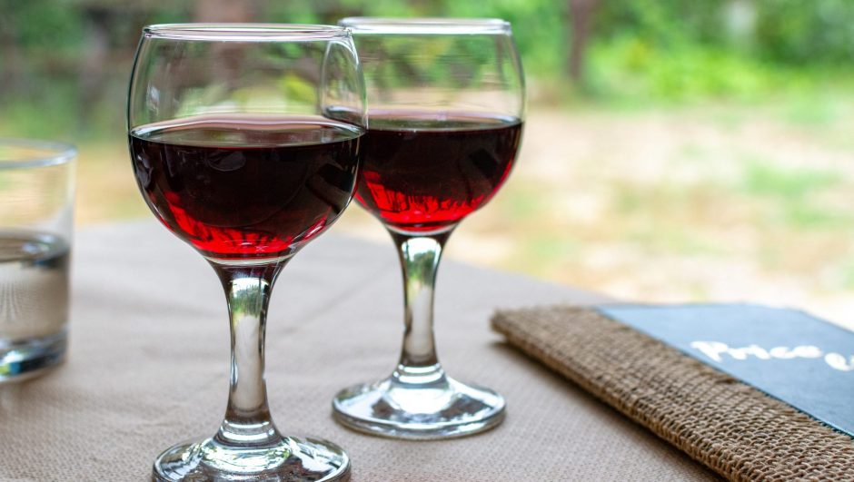 Red greek wine is glass from Nemea region, wine tasting, close up