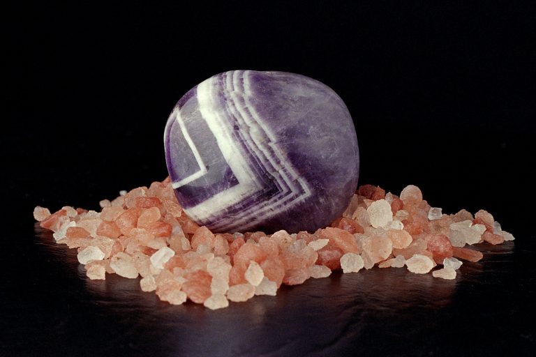Chevron amethyst on a bed of pink himalayan salt