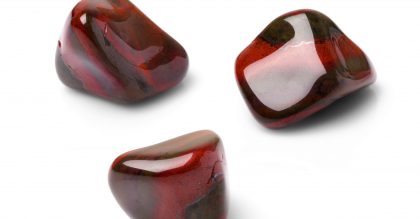 Red tiger eye polish gem shot from three points of view.