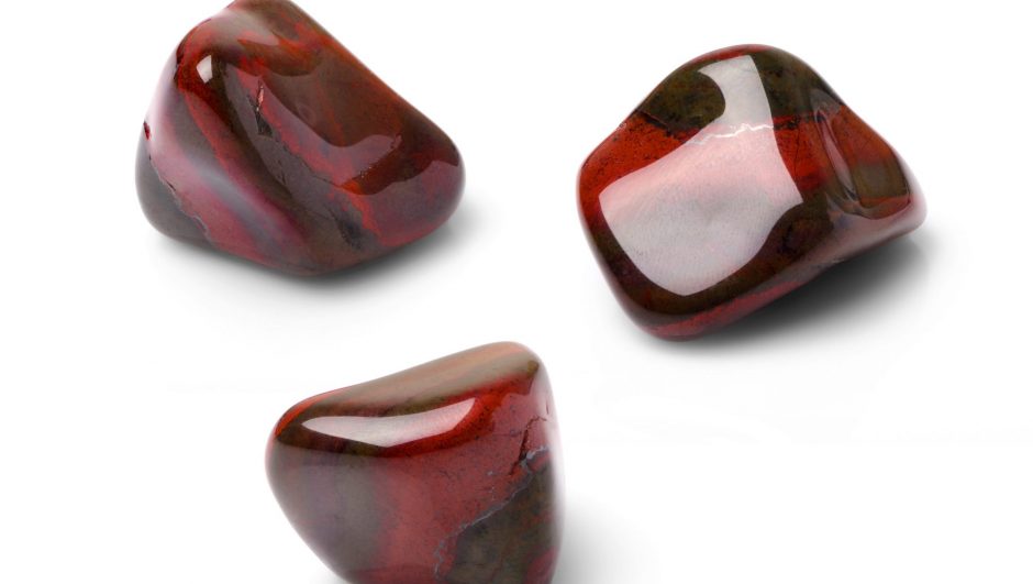 Red tiger eye polish gem shot from three points of view.